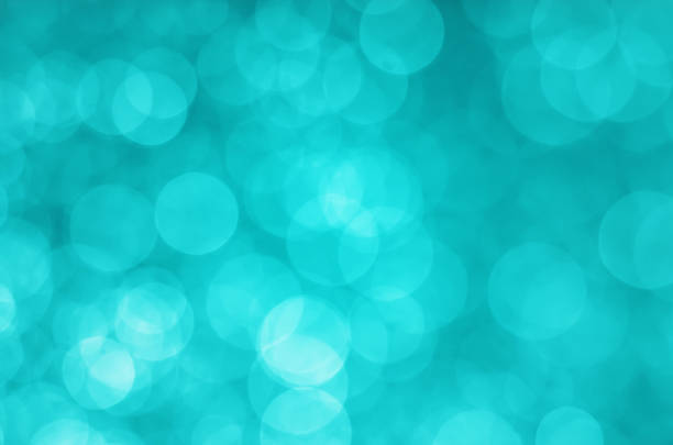 istock abstract yellow green blue bokeh glitter sparkle background. 956997112