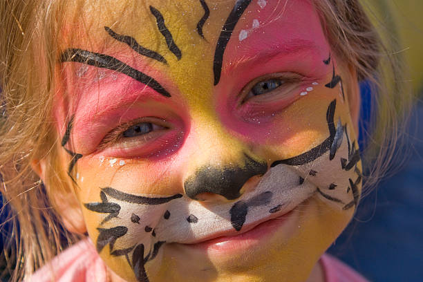 istock Little Girl with painted on tiger face 95699941
