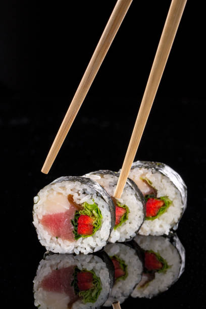 istock sushi on the black background 957000482