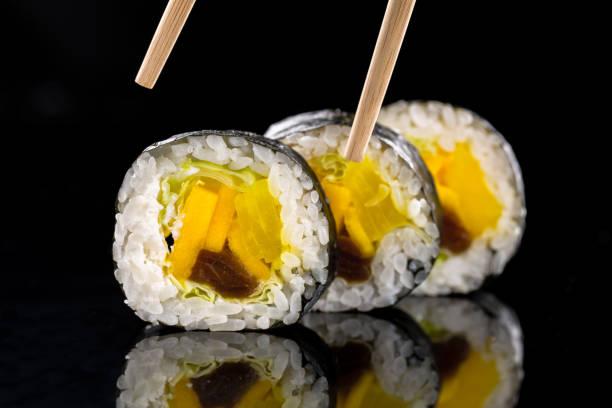 istock sushi on the black background 957000590