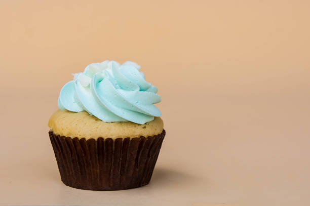 istock sweet cup cake dessert on yellow background and copy space 957001294