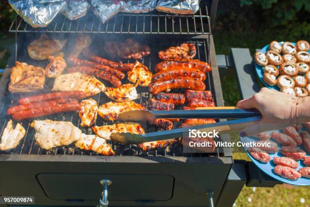 Grilling Food On Barbecue Grill Hands Preparing Skewers Stock Photo - Download Image Now