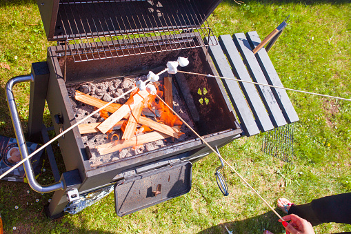 Grilling munchmallow on barbecue grill