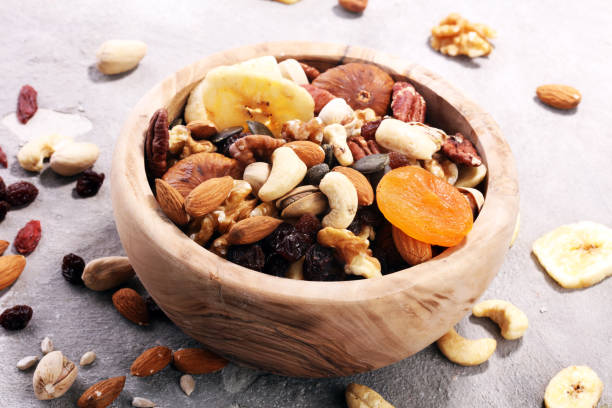 istock Composition with dried fruits and assorted healthy nuts 957019506