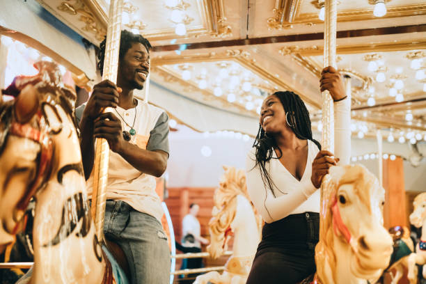 istock Couple Has Fun Together on Carousel 957019860