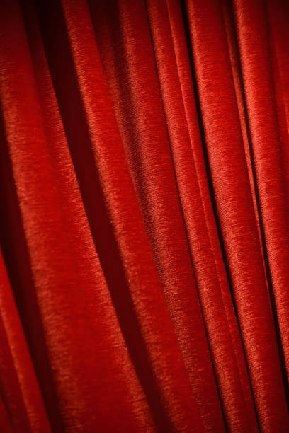 istock Red cotton made curtains isolated unique background photo 957020520