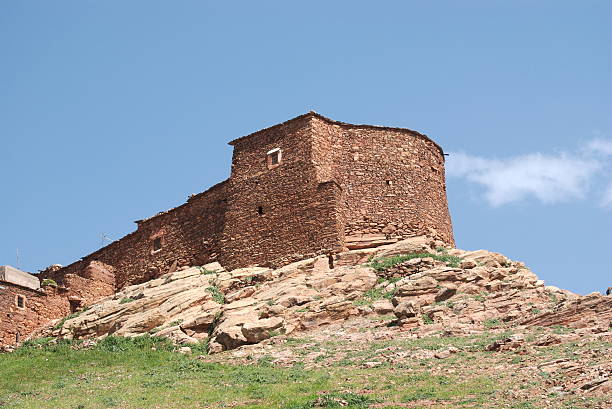 Stone house on a rock promontory stock photo