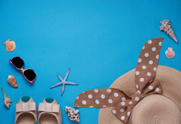 istock Straw hat, sunglasses and shoes on blue background 957023136