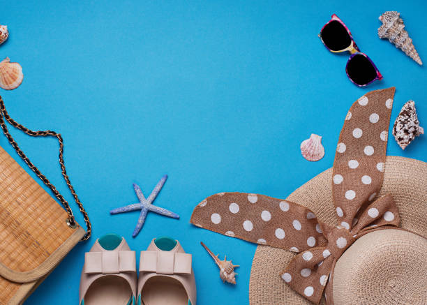istock Straw hat, sunglasses and shoes on blue background 957023228