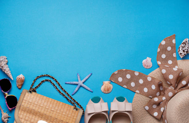 istock Straw hat, sunglasses and shoes on blue background 957023290