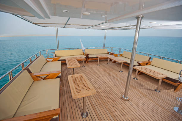 istock Table and chairs on deck of a luxury motor yacht 957023452