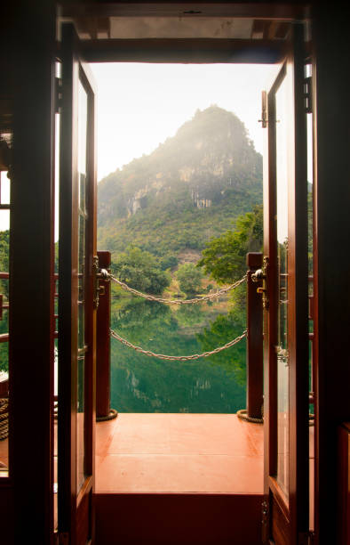 istock Sunset view through a boat door over a lake in China 957023726