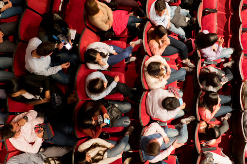 High angle view of people at a theater waiting for the performance to start