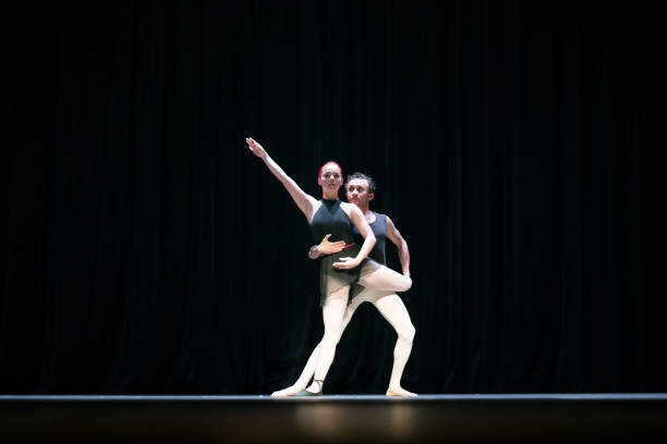 istock Ballet couple performing on stage 957023810