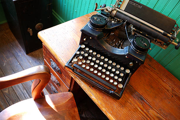 istock 1800s Style Typewriter on Antique Desk with Chair 95702622
