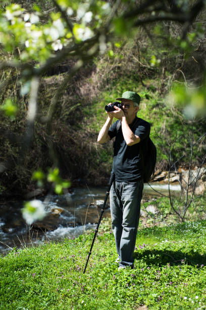 istock Senior man taking pictures on a hiking trip 957027498