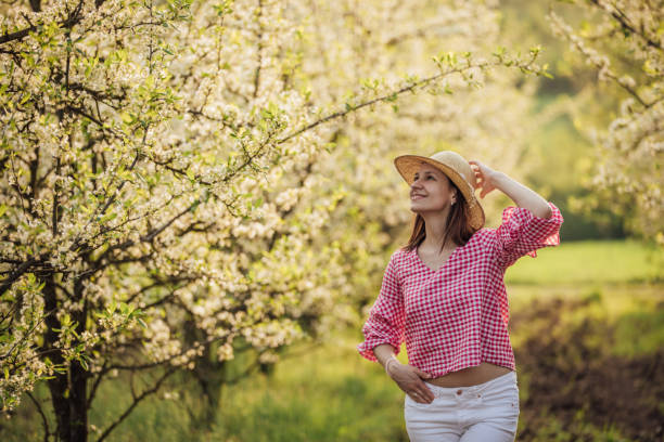 istock Beautiful girl in orchard 957027520