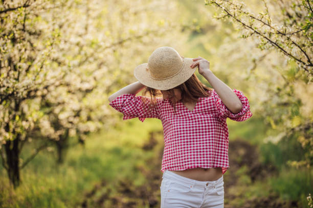 istock Charming girl in orchard 957027654