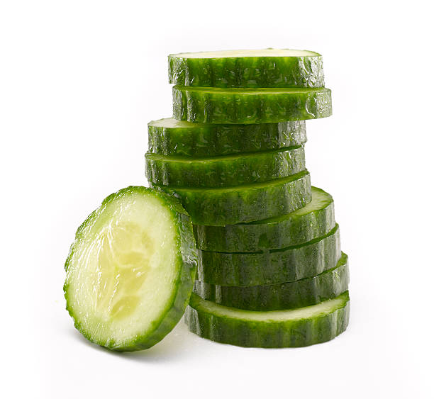 Sliced Cucumber in Stack  cucumber slice stock pictures, royalty-free photos & images