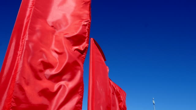 Scarlet flags.