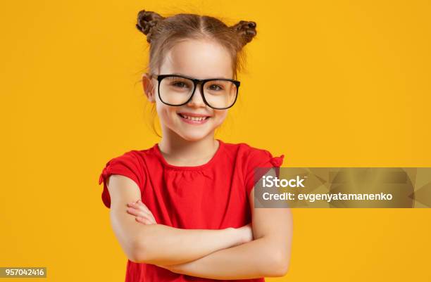 Funny Child Girl In Glasses On Colored Background Stock Photo - Download Image Now - Child, Eyeglasses, Girls