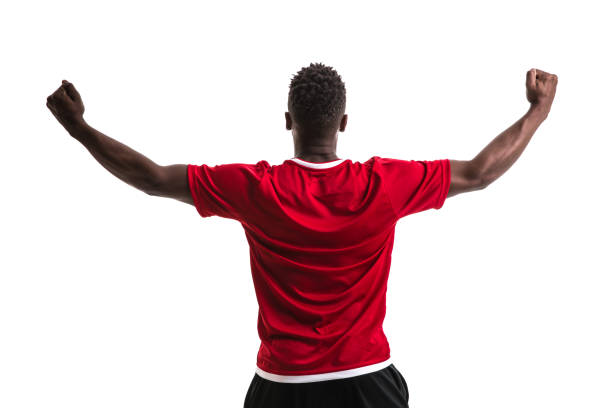 istock Fan / Sport Player on red uniform celebrating on white background 957043126