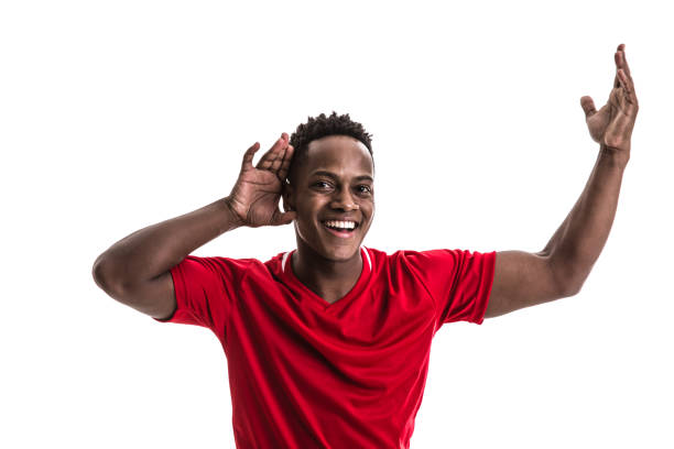 istock Fan / Sport Player on red uniform celebrating on white background 957043132