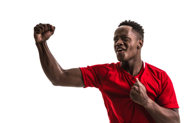istock Fan / Sport Player on red uniform celebrating on white background 957043150