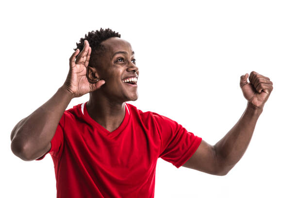 istock Fan / Sport Player on red uniform celebrating on white background 957043156