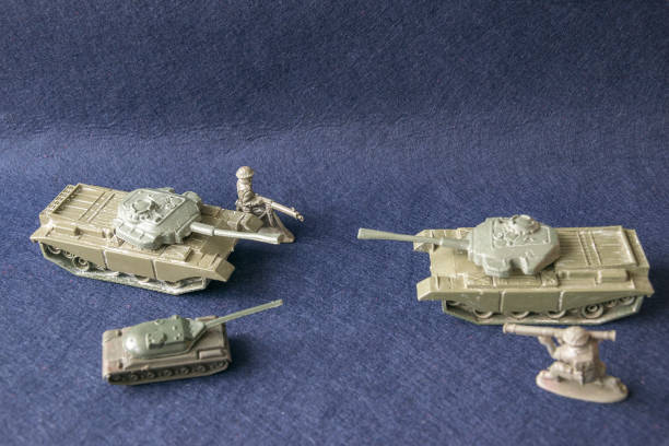 istock Scale models of toy plastic tanks and soldiers 957046622