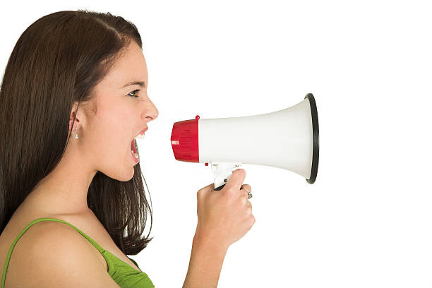 istock Side profile of woman screaming through a megaphone 95704894