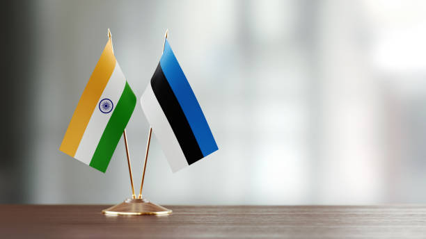 istock Indian And Estonian Flag Pair On A Desk Over Defocused Background 957050484