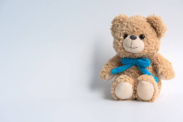 istock Children doctor concept - Teddy Bear with stethoscope on white background. copy space 957053416