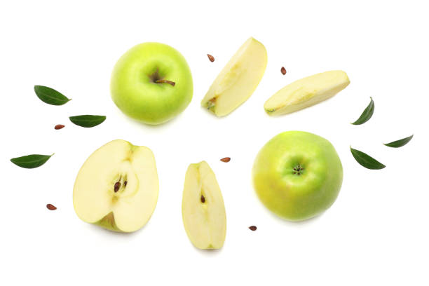 istock green apples with slices isolated on white background. top view 957053636