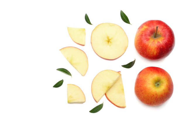 istock red apples with slices isolated on white background. top view 957053642