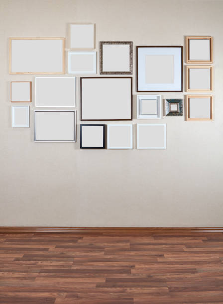Various sizes of blank picture frames hanging