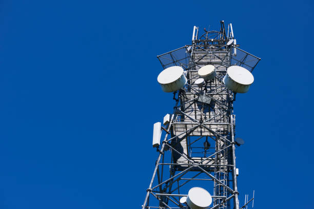 istock Telecommunication tower with antennas against the blue sky 957055040