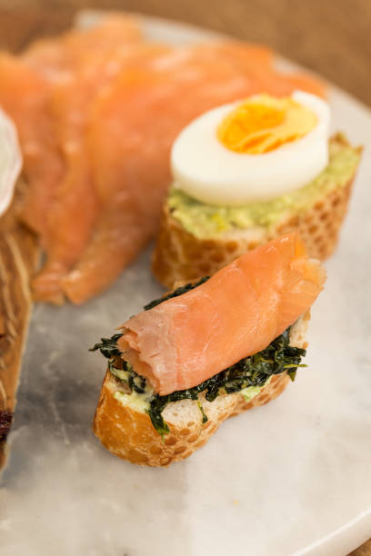 istock Healthy breakfast. Toast with spinach and smoked salmon. 957055144