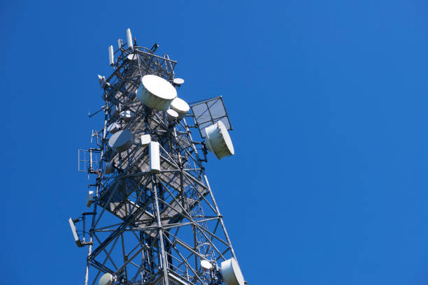 istock Telecommunication tower with antennas against the blue sky 957057492