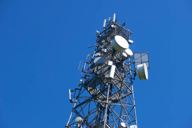 istock Telecommunication tower with antennas against the blue sky 957057518