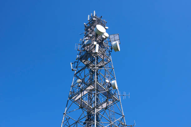 istock Telecommunication tower with antennas against the blue sky 957057566