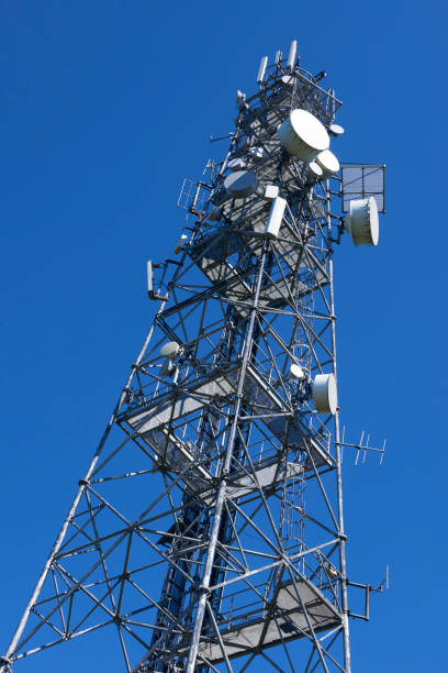 istock Telecommunication tower with antennas against the blue sky 957057618