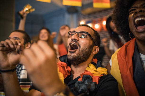 istock Soccer fans cheering 957062082