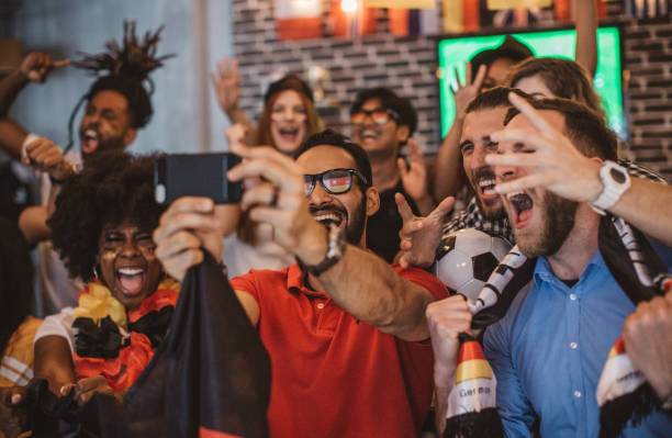 istock Soccer fans cheering 957064440
