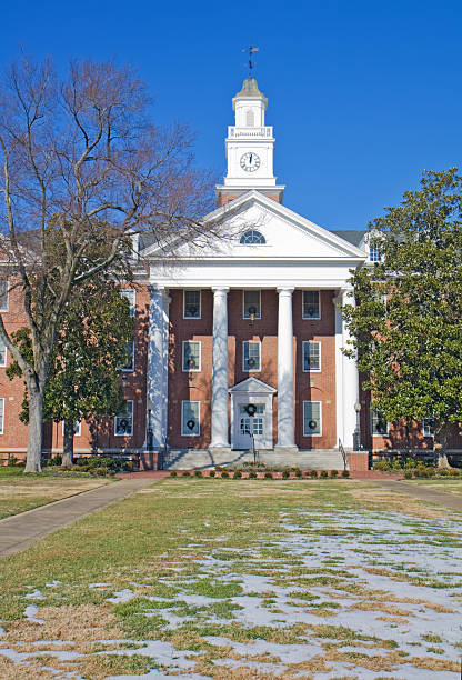 Isolated Classic University Building with Red Flag on Tower