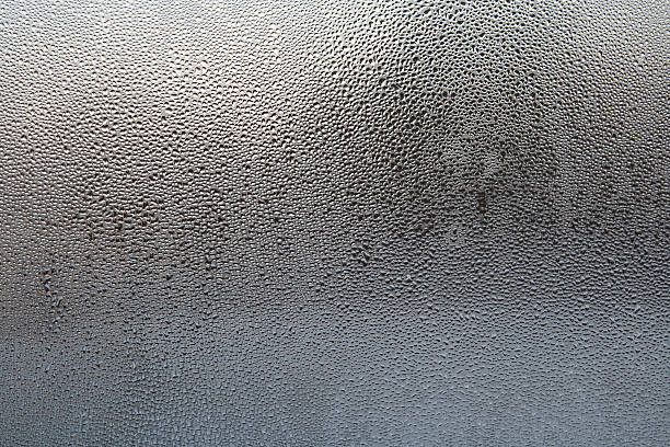 istock Wet glass with drops of water in black and blue gradient 95706668