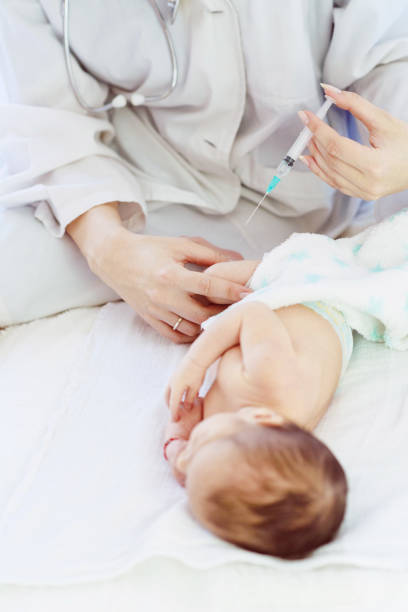 istock Pediatrician vaccinating newborn 957068780