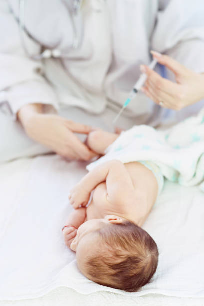 istock Pediatrician vaccinating newborn 957068788