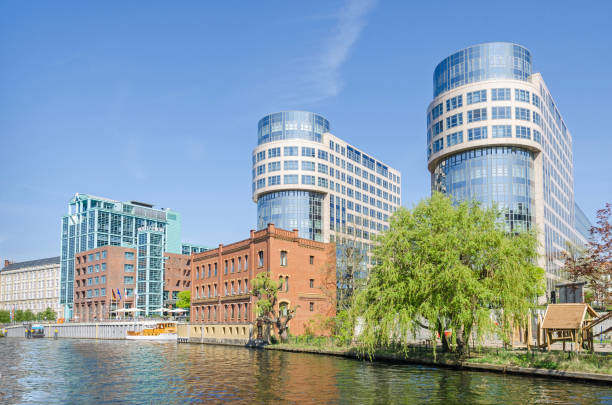 Banks of the river Spree with the Hotel Abion Spreebogen Waterside and restaurant Lanninger in Berlin Berlin, Germany - April 22, 2018: Banks of the river Spree with the Hotel Abion Spreebogen Waterside, restaurant Lanninger and office building "Spreebogen" in the city center in springtime. moabit stock pictures, royalty-free photos & images