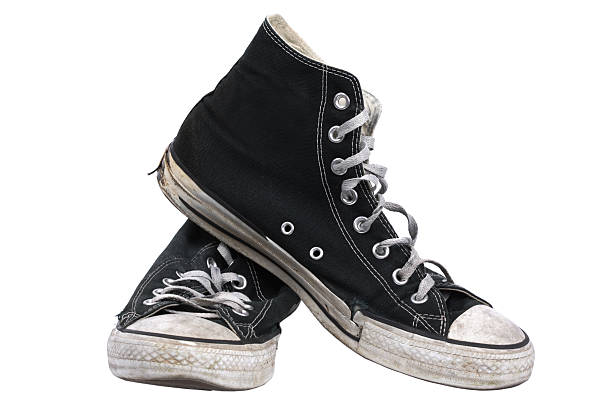 Old canvas sneakers, isolated with clipping path stock photo